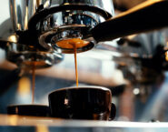 espresso machine brewing from below close up