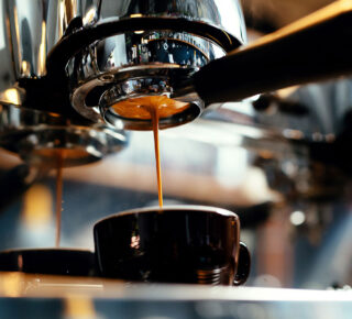 espresso machine brewing from below close up